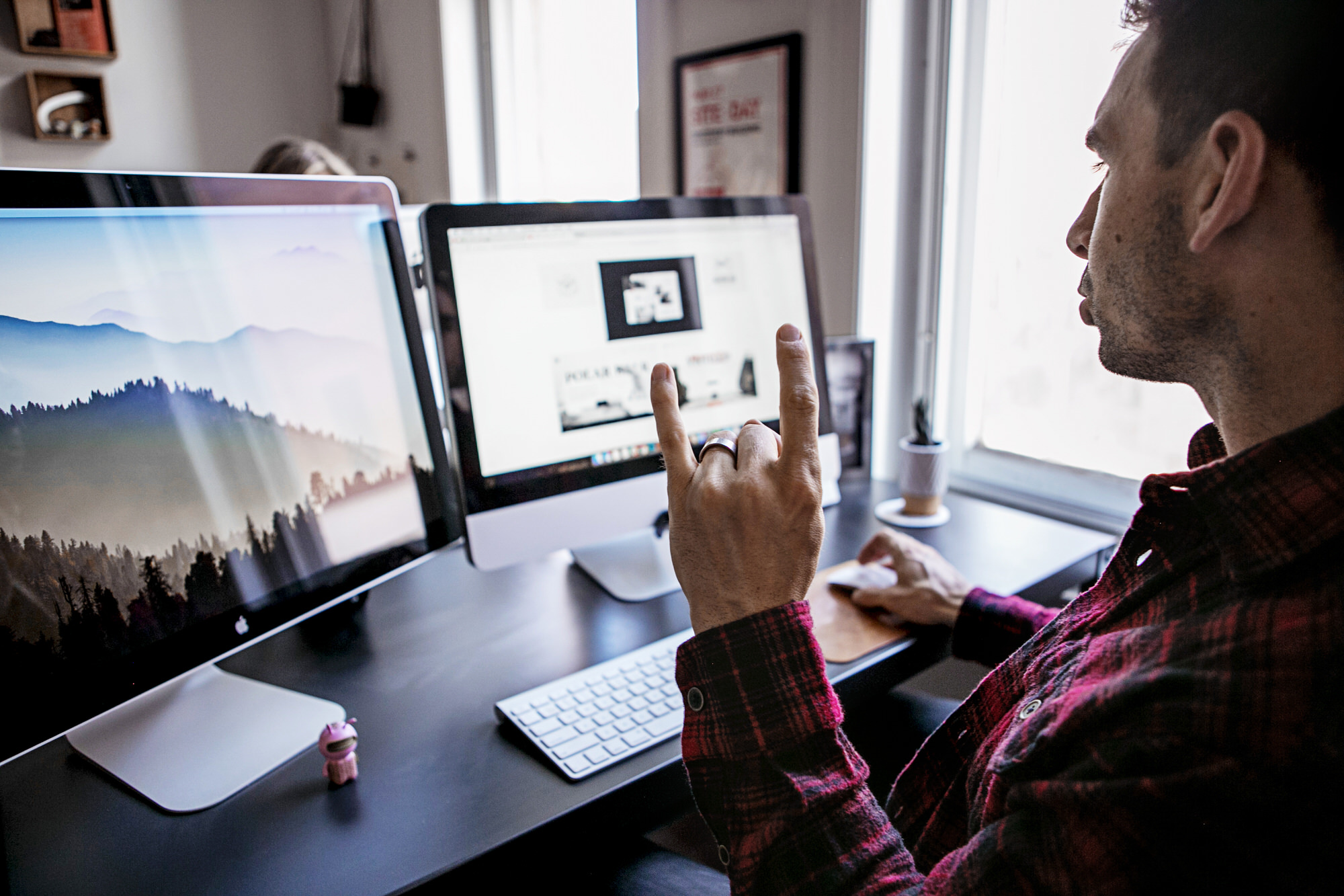 man building website at computer